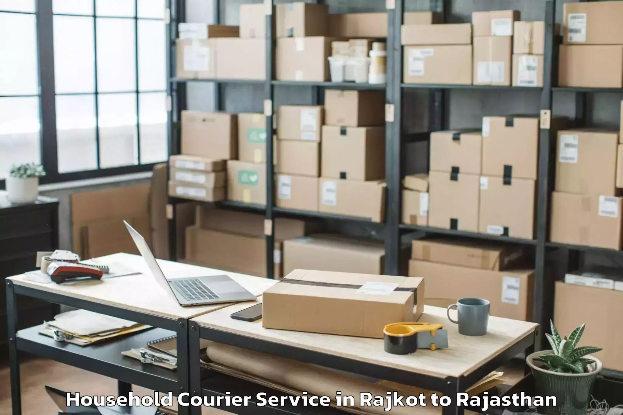 Book Rajkot to Jk Lakshmipat University Jaipu Household Courier Online